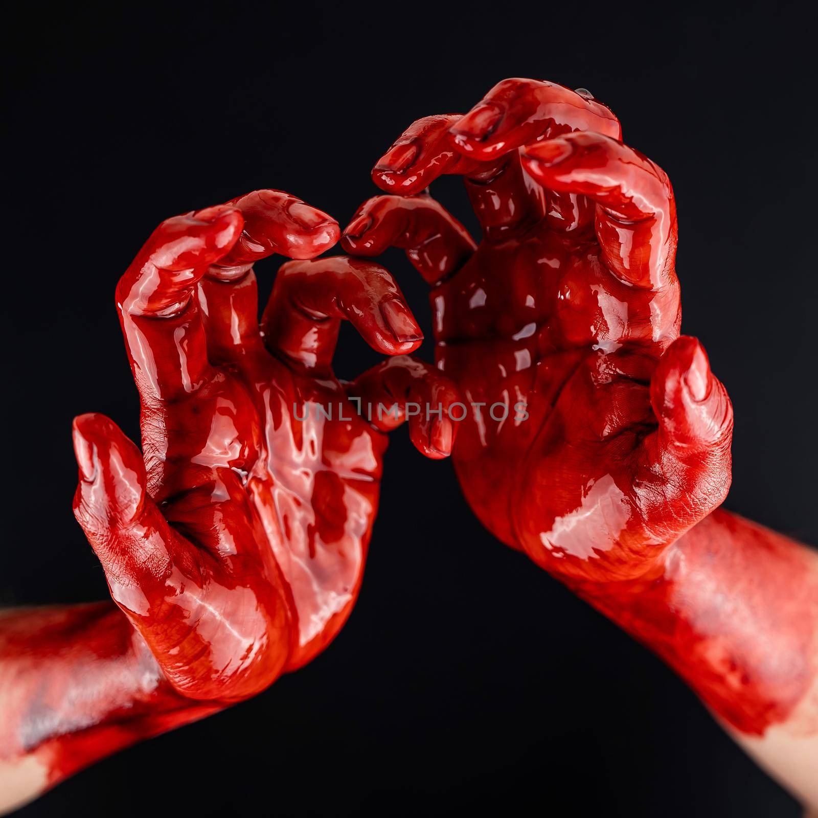 Women's hands in blood on a black background. by mrwed54