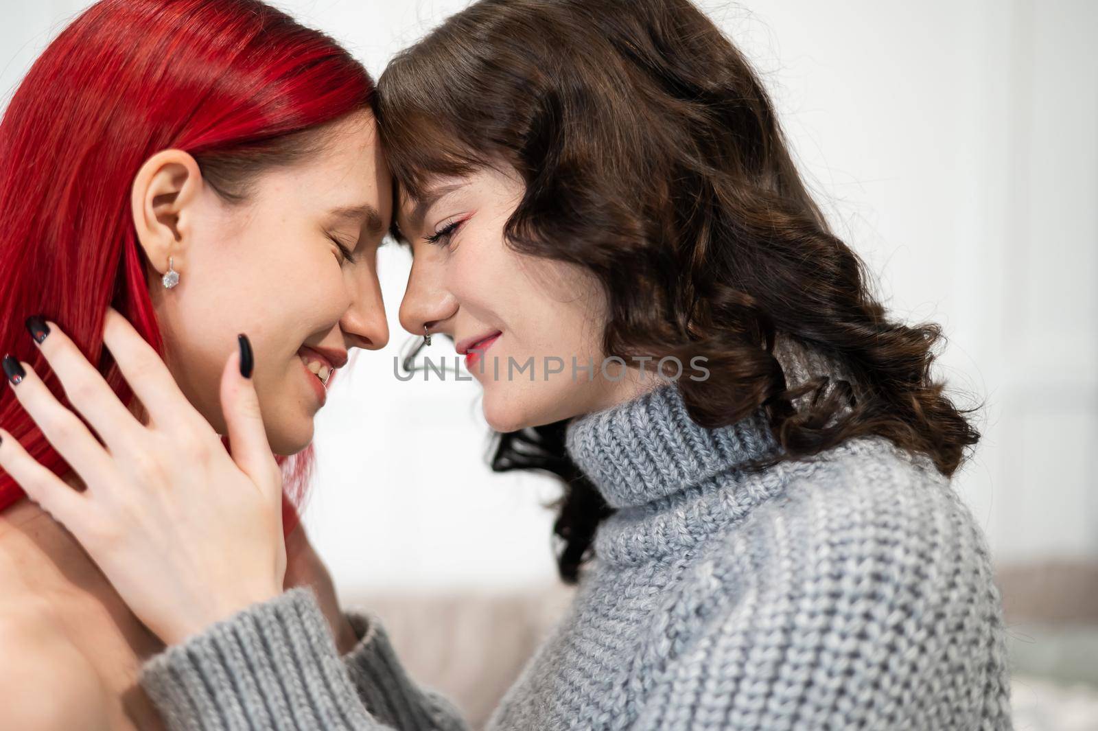 Young Caucasian women hugging tenderly. Same-sex relationships