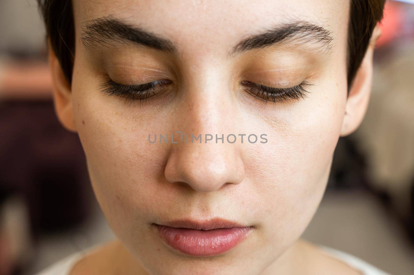 Caucasian woman before procedure in beauty salon