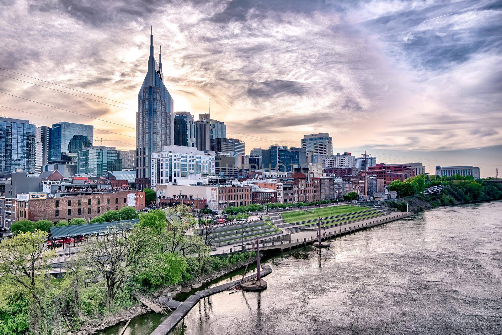Nashville tennessee city skyline at sunset on the waterfrom by digidreamgrafix