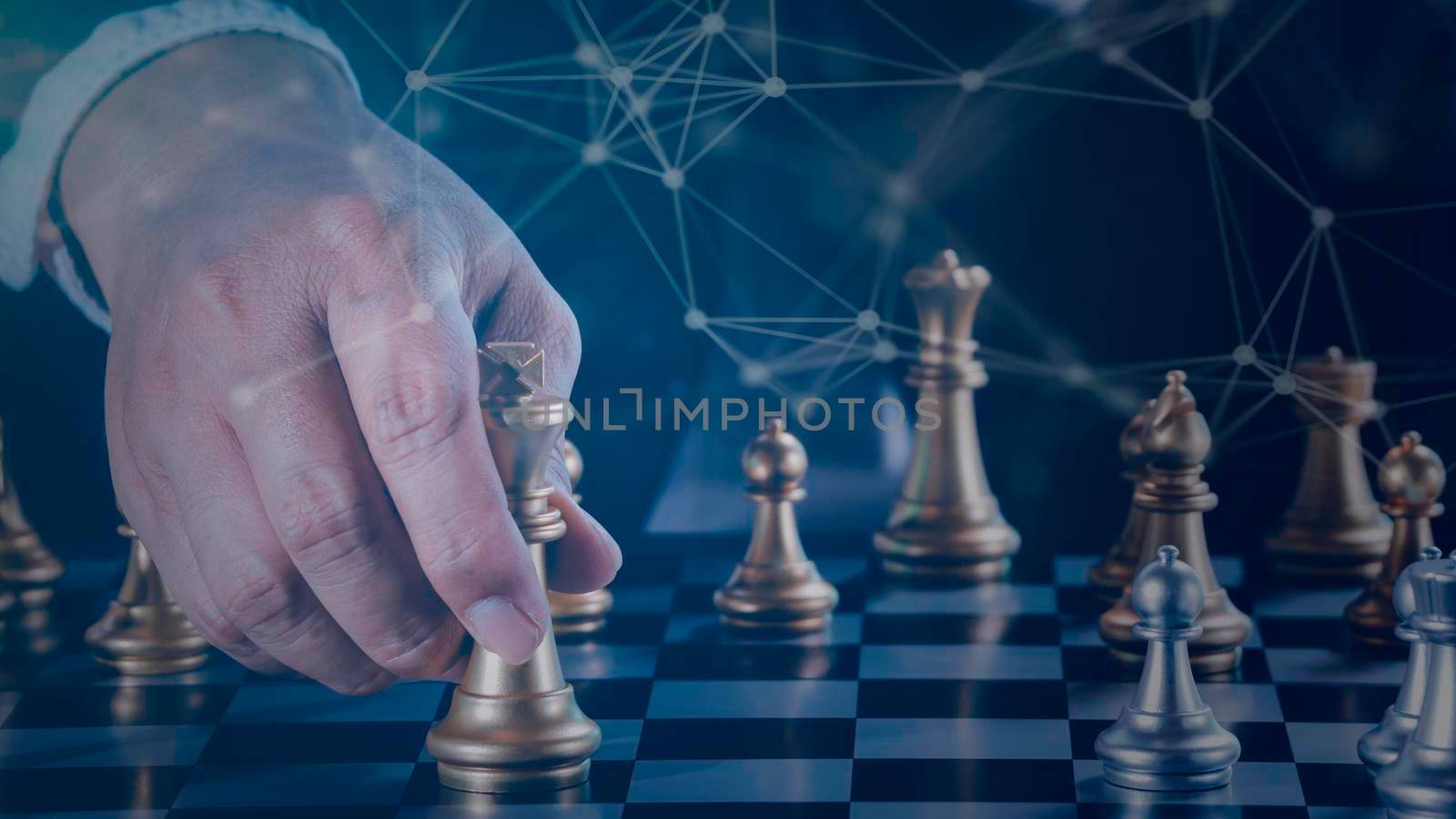 Hand of businessman holding gold king chess on stock market or forex trading graph chart with cityscape image economy trend for digital financial investment.Management or leadership strategy concept. by Chakreeyarut