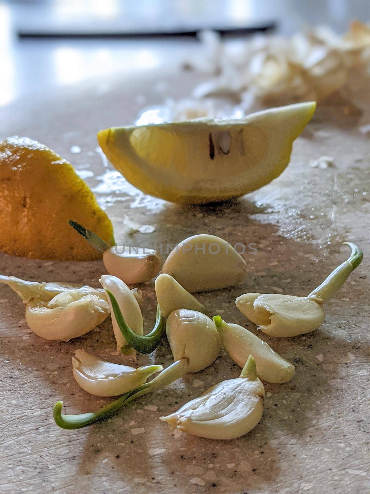 garlic and lemon lime on cutting board