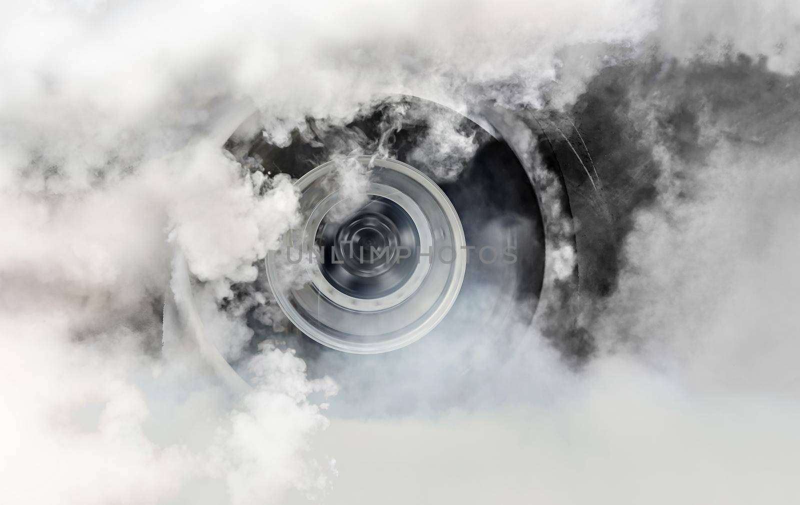 Drag racing car burns rubber off its tires in preparation for the race