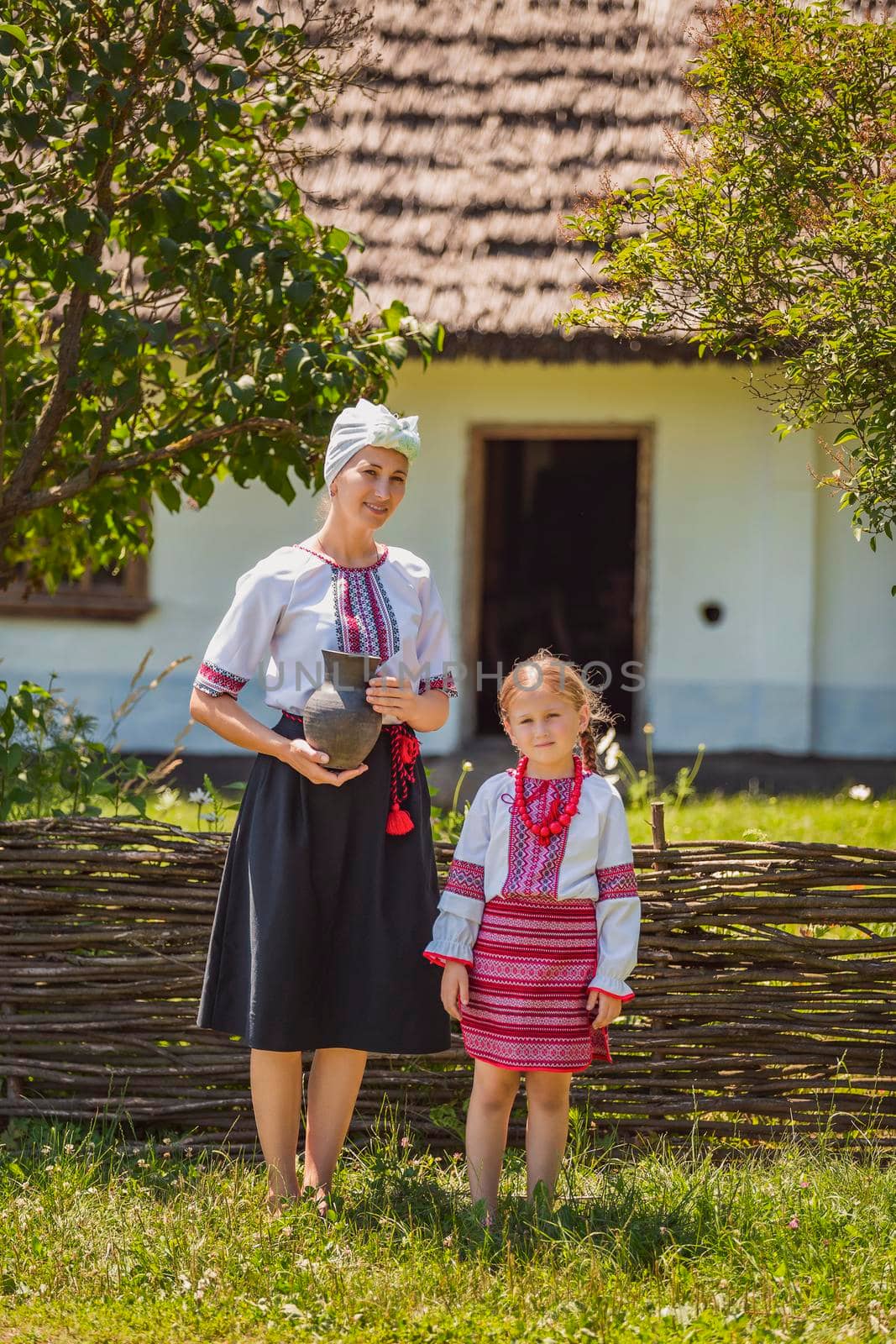 mother and daughter in Ukrainian national costumes by zokov
