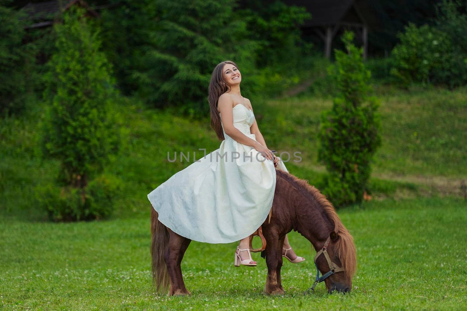 girl in a white dress riding a pony by zokov