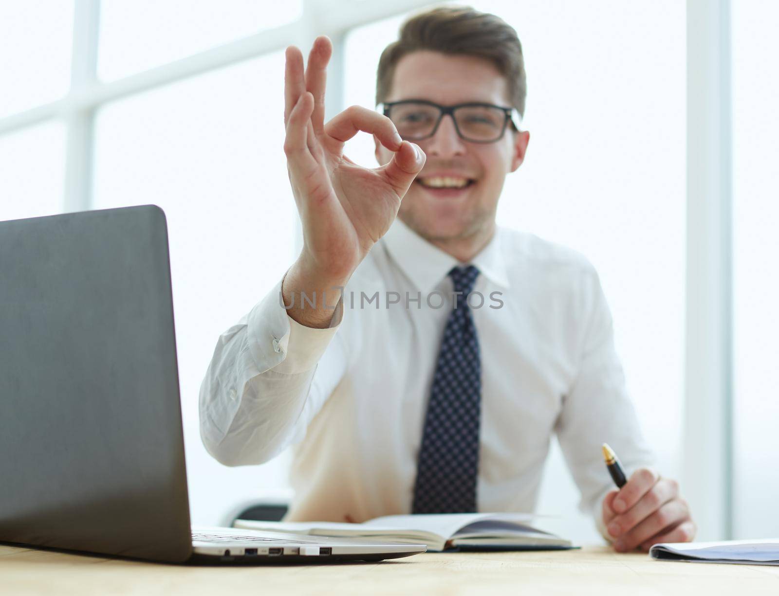 bright picture of man hands showing ok sign by Prosto