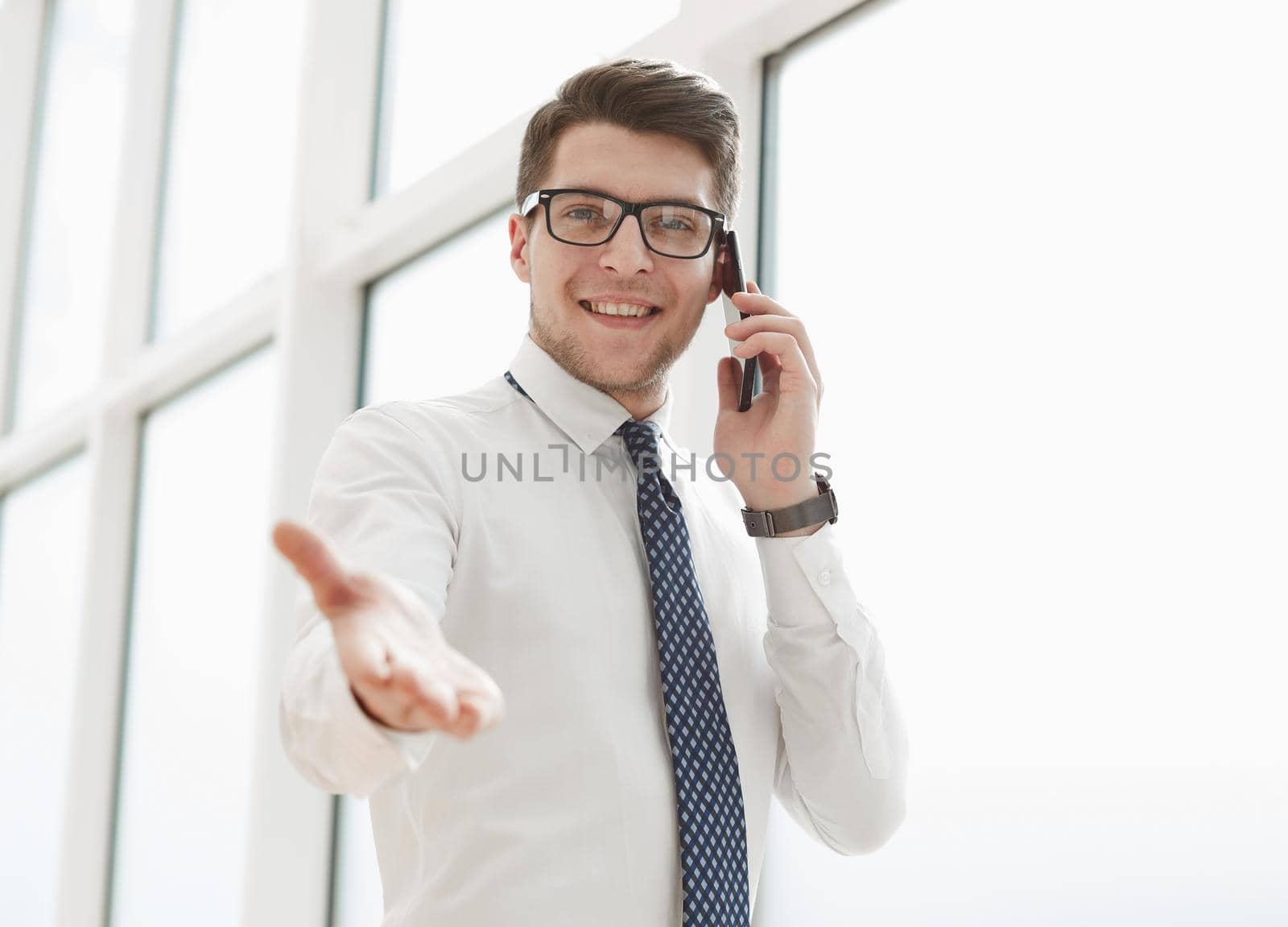 Businessman Making Phone Call In Office by Prosto