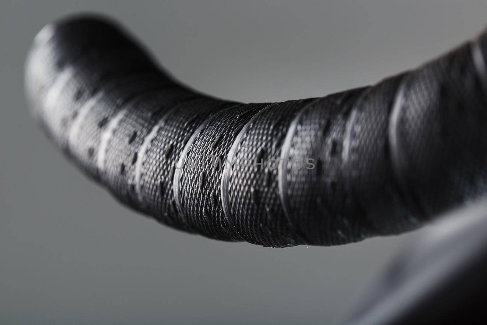 Handlebar winding of a road bike close-up on a gray background