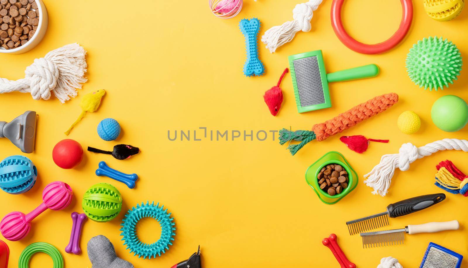 Pet care concept, various pet accessories and tools on yellow background, flat lay by Desperada