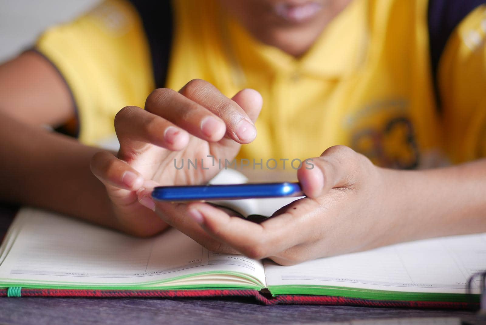 child hand pointing finger on smart phone screen