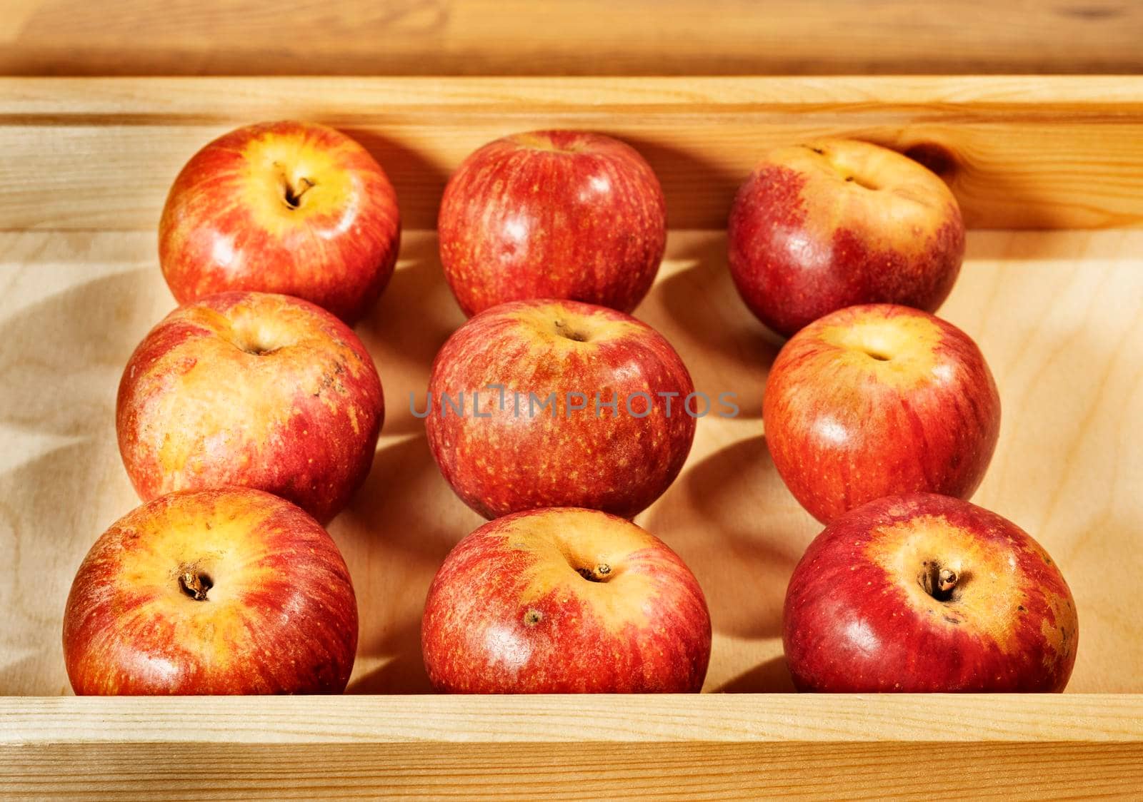 Wooden crate with red ripe Annurca apples ,apple to Southern Italy