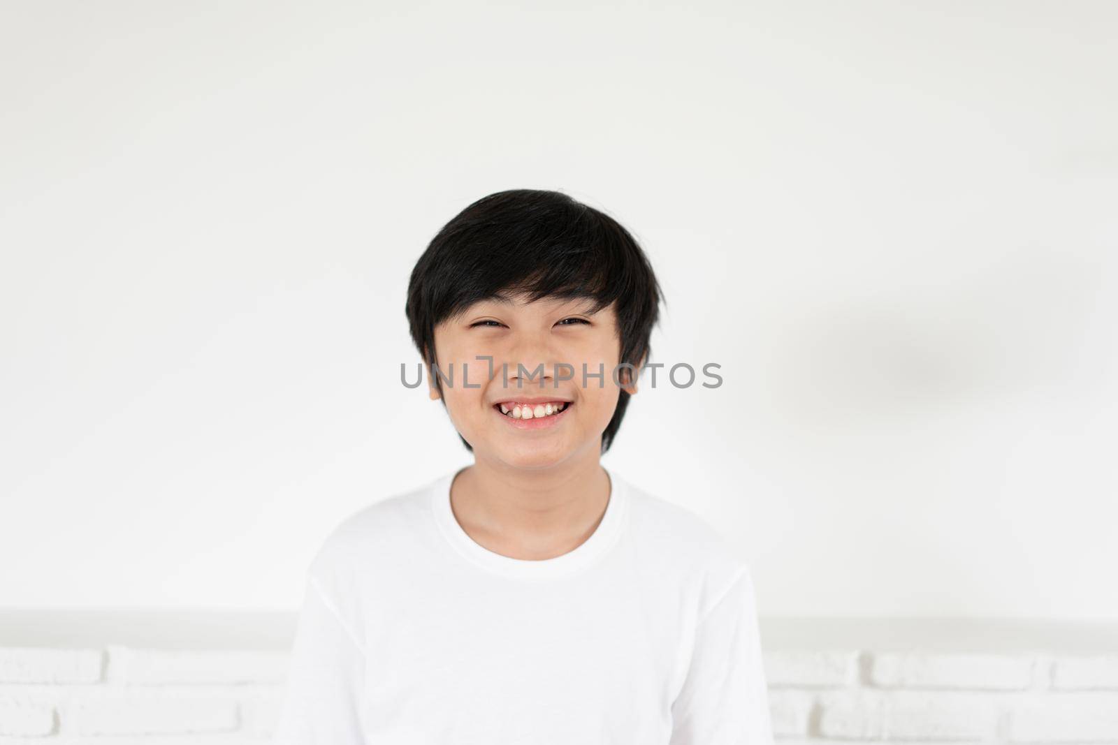 Little boy smile with copy space on white background