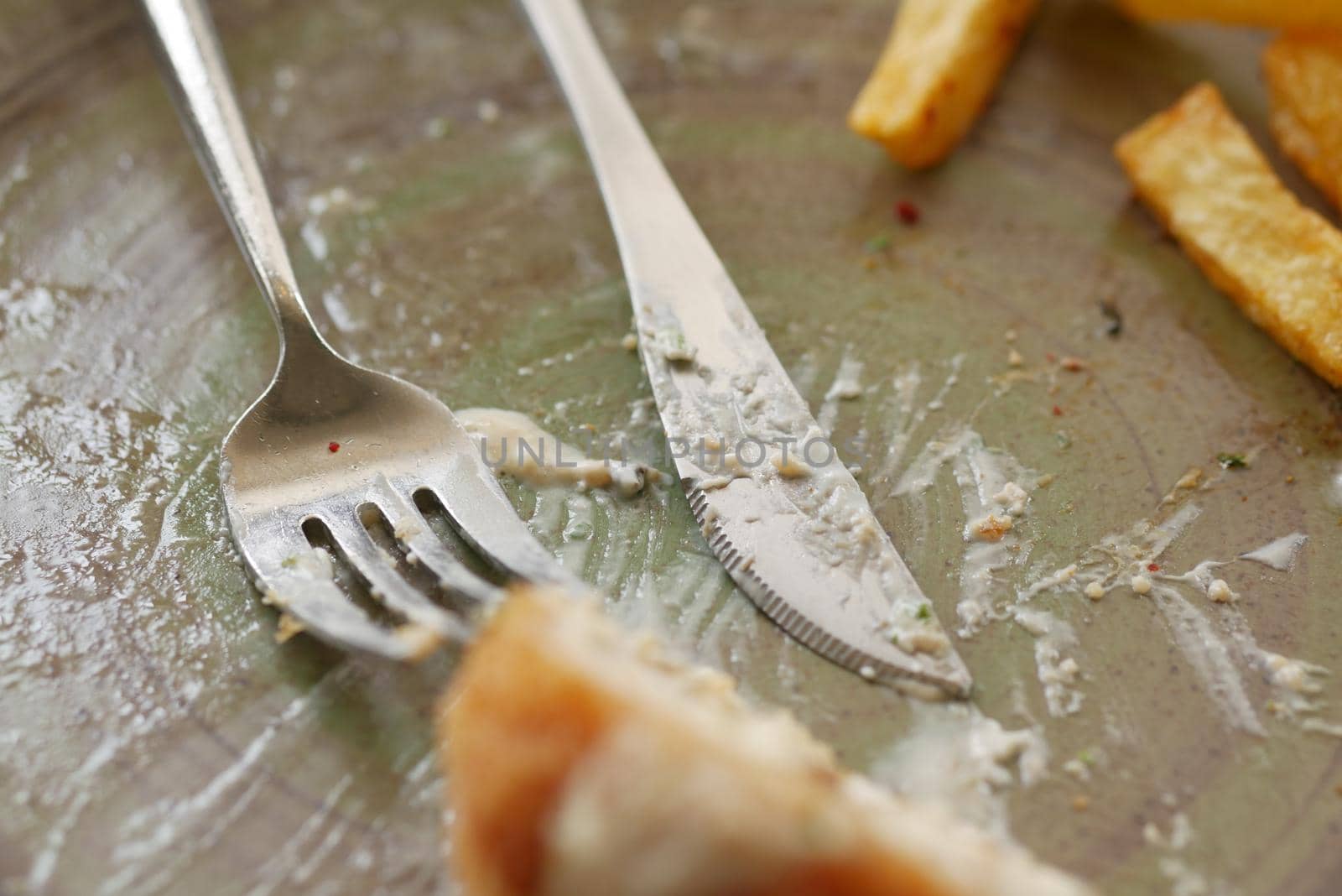 Empty plate after eating on table ,