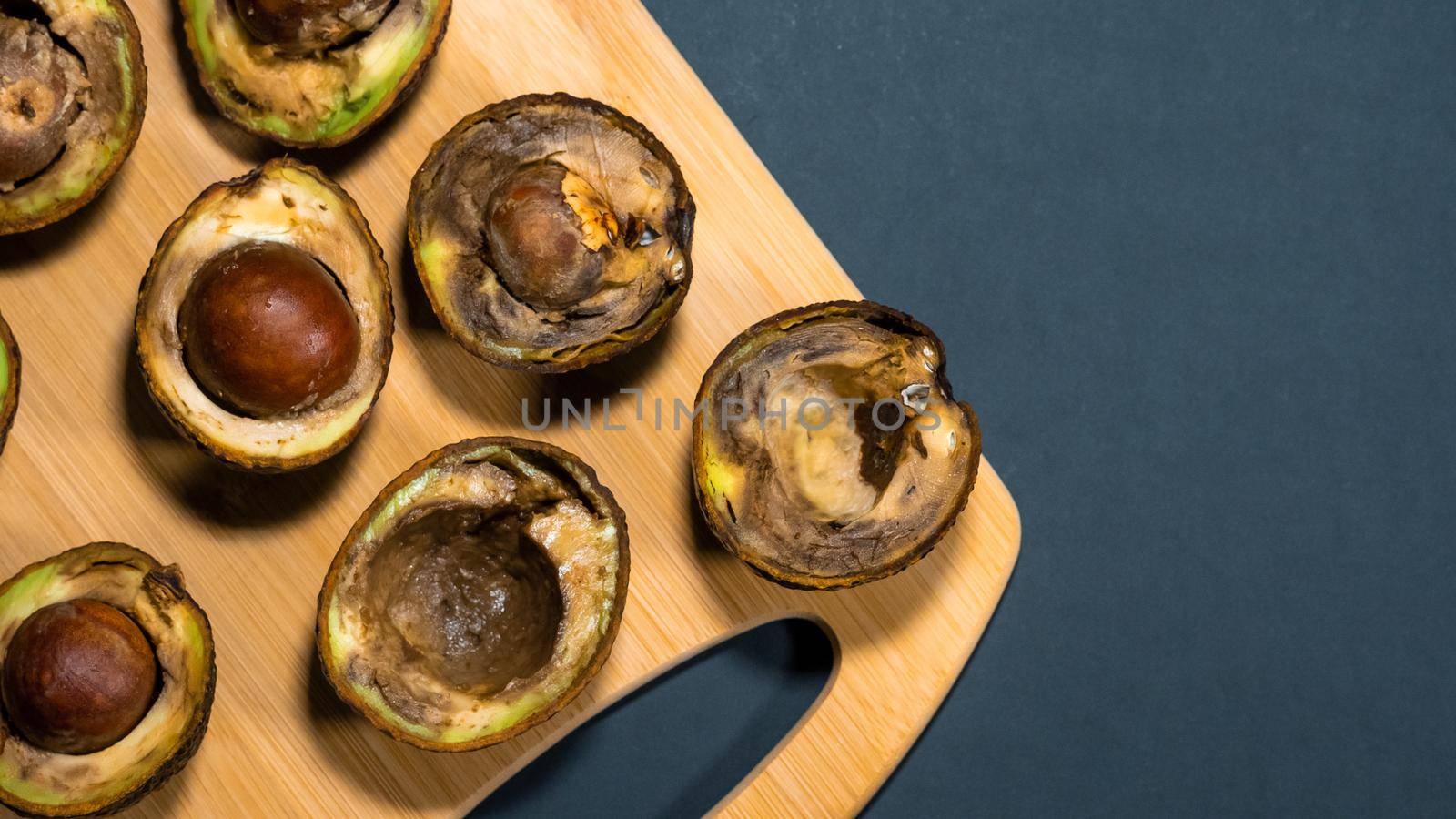 Bad avocado fruits. Close up tropical ugly avocado. by RecCameraStock