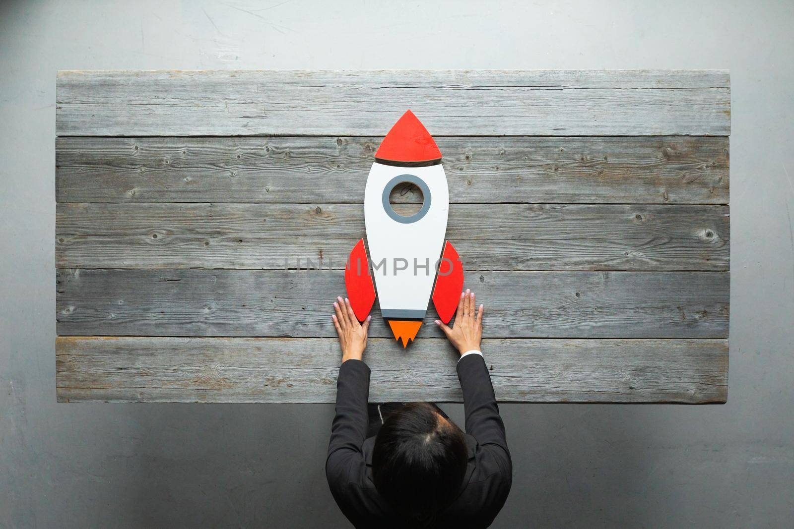 Business person launch space rocket by ALotOfPeople