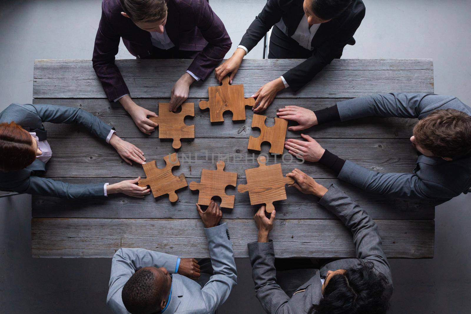 Business teamwork with white puzzle cooperation unity concept