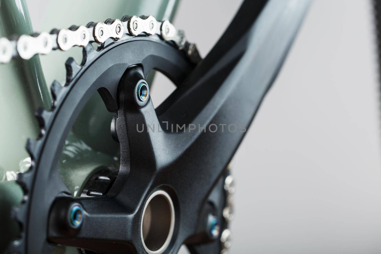 The leading star of a bicycle with a connecting rod and a chain close-up by AlexGrec