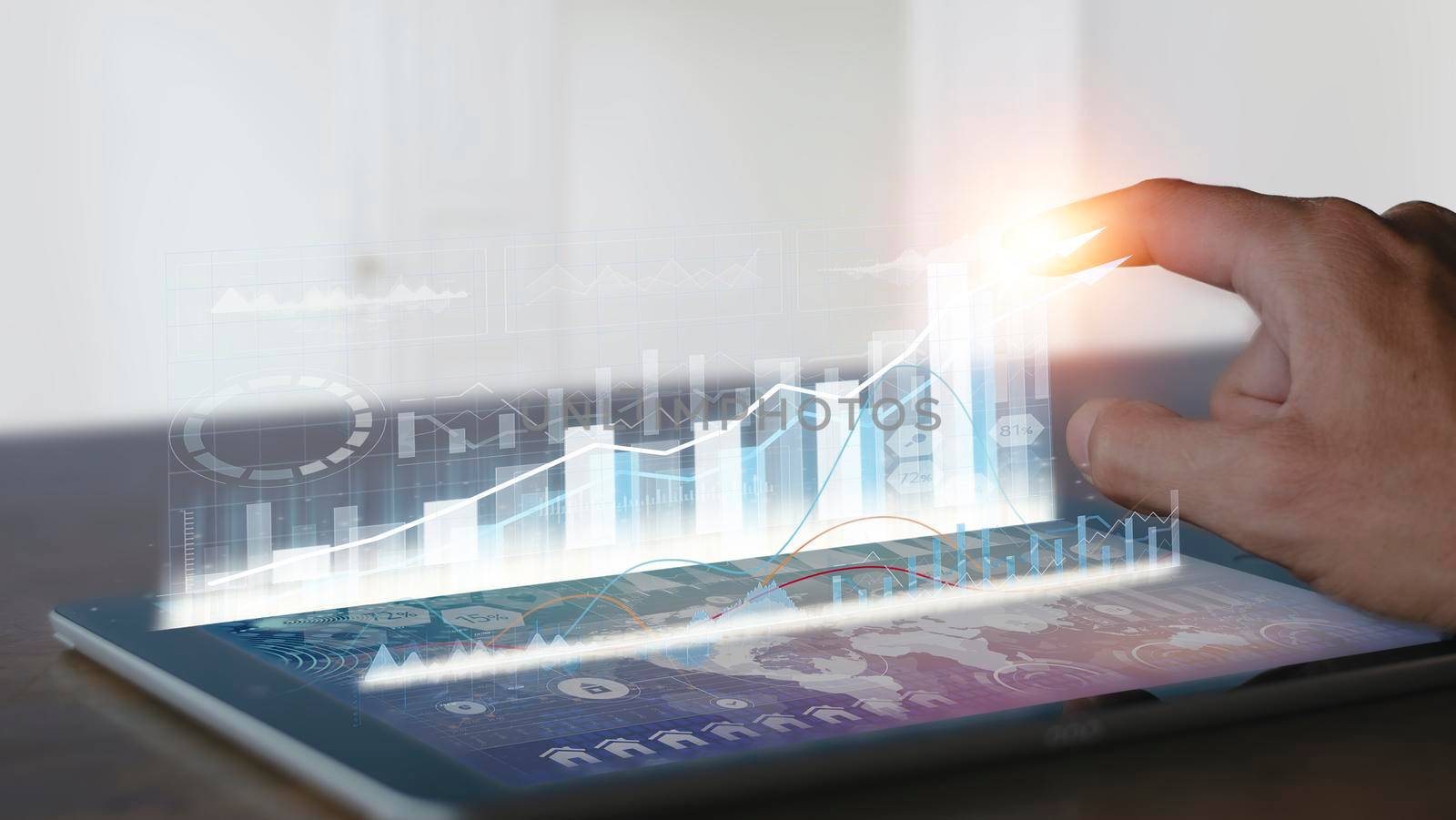 Businessman use tablet analysis graph for trade stock market on the screen Businessman hands use tablet check chart stock growth. Hand male stock graph chart point target success