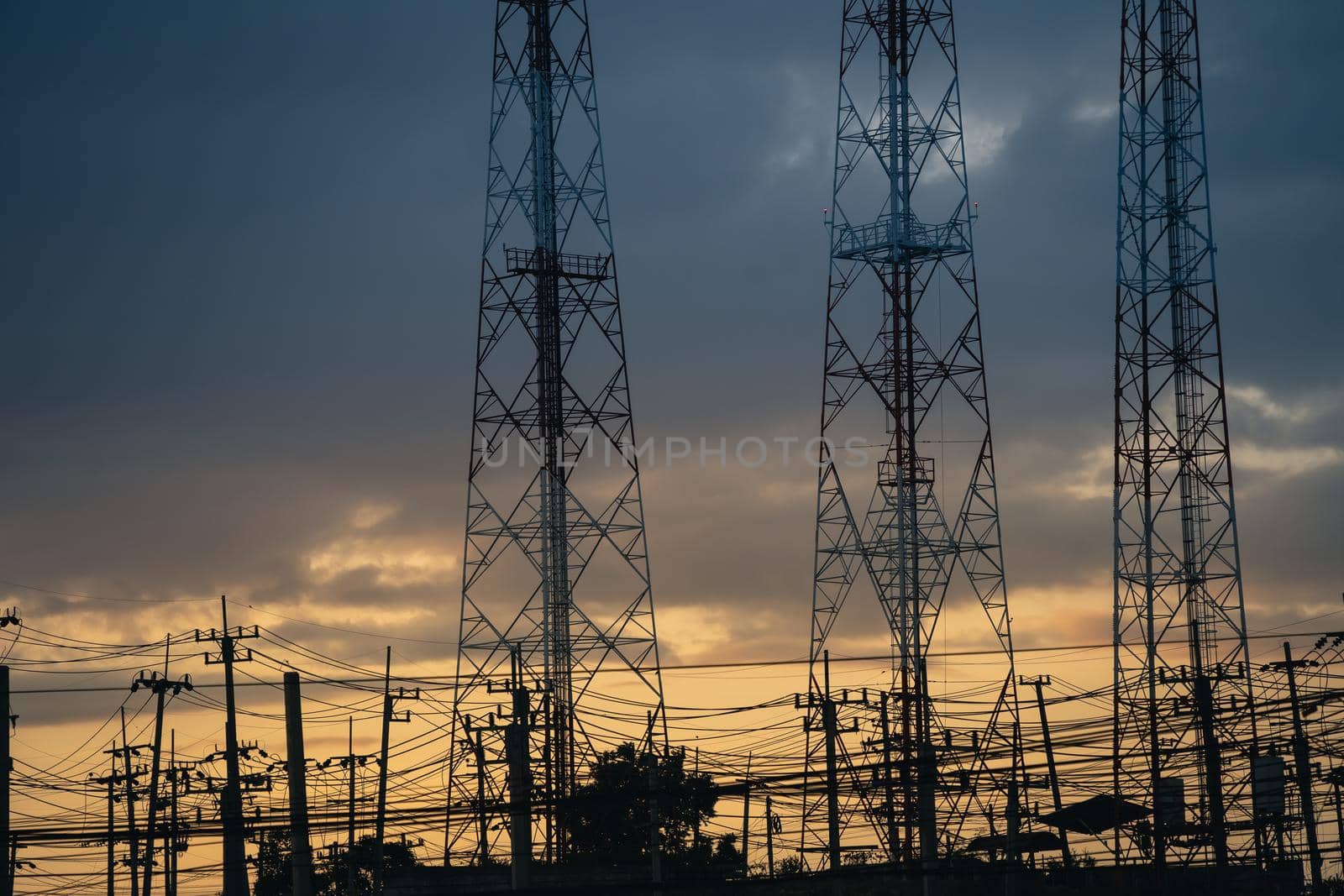 high voltage post.High voltage tower at power plant sunset evening golden time  sky background
