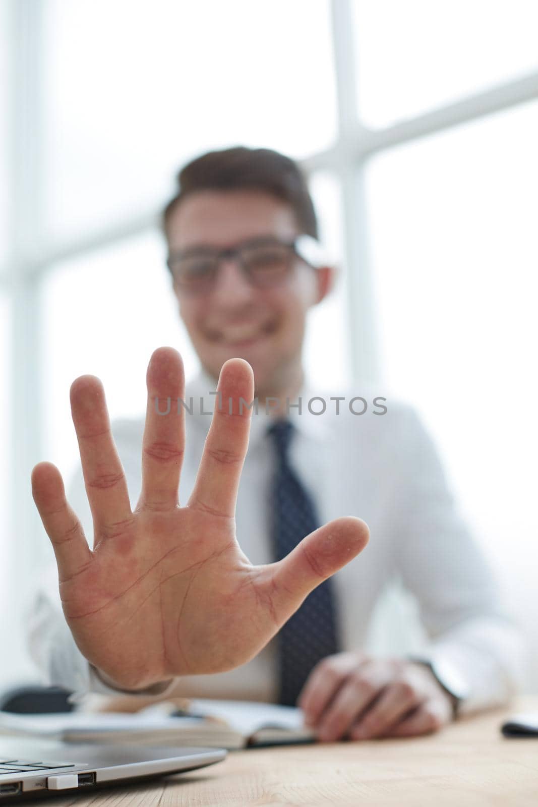 Young businessman man showing number five with fingers on hand by Prosto