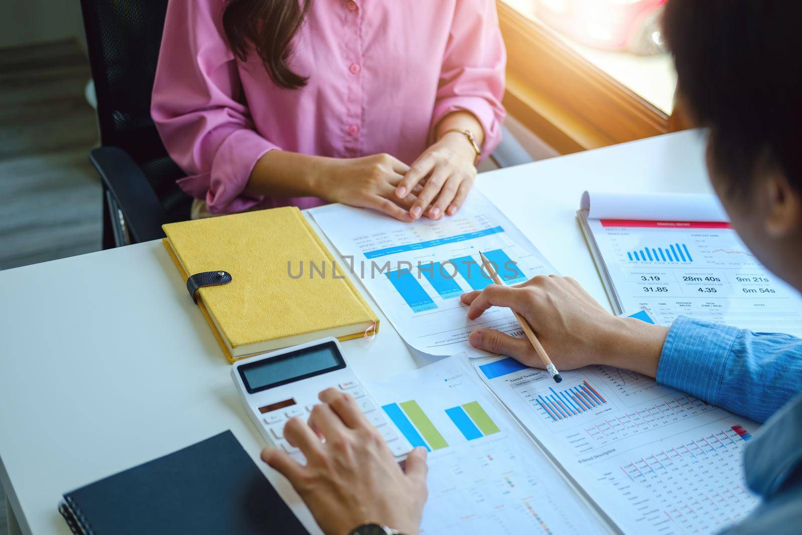 Teamwork concept, consultation, economist pointing budget, finance and investment documents, discussing and planning finances with advisors in conference room by Manastrong