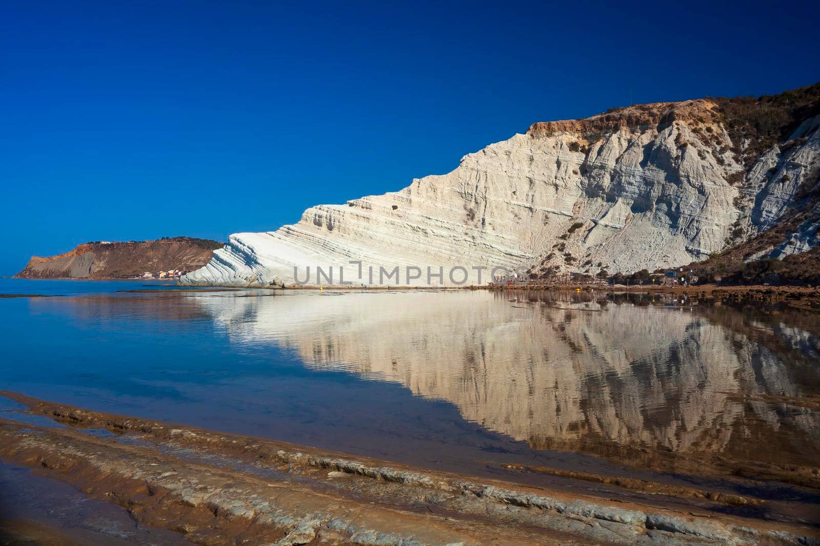 Limestone white cliffs with beach at the Scala dei Turchi, Realmonte. Agrigento by bepsimage