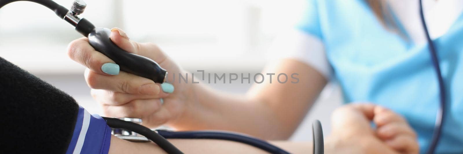 Close-up of medical worker check blood pressure of old patient, risk of hypertension, prevent disease. Check with stethoscope tool. Medicine, healthcare, checkup concept