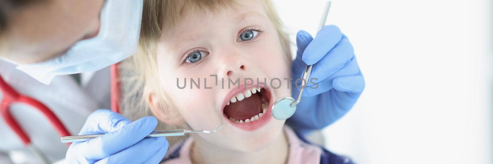 Portrait of cute kid visiting family doctor, pediatrician with tool check hurting throat, medical worker work with children. Healthcare, child care, medicine, clinic, childhood concept