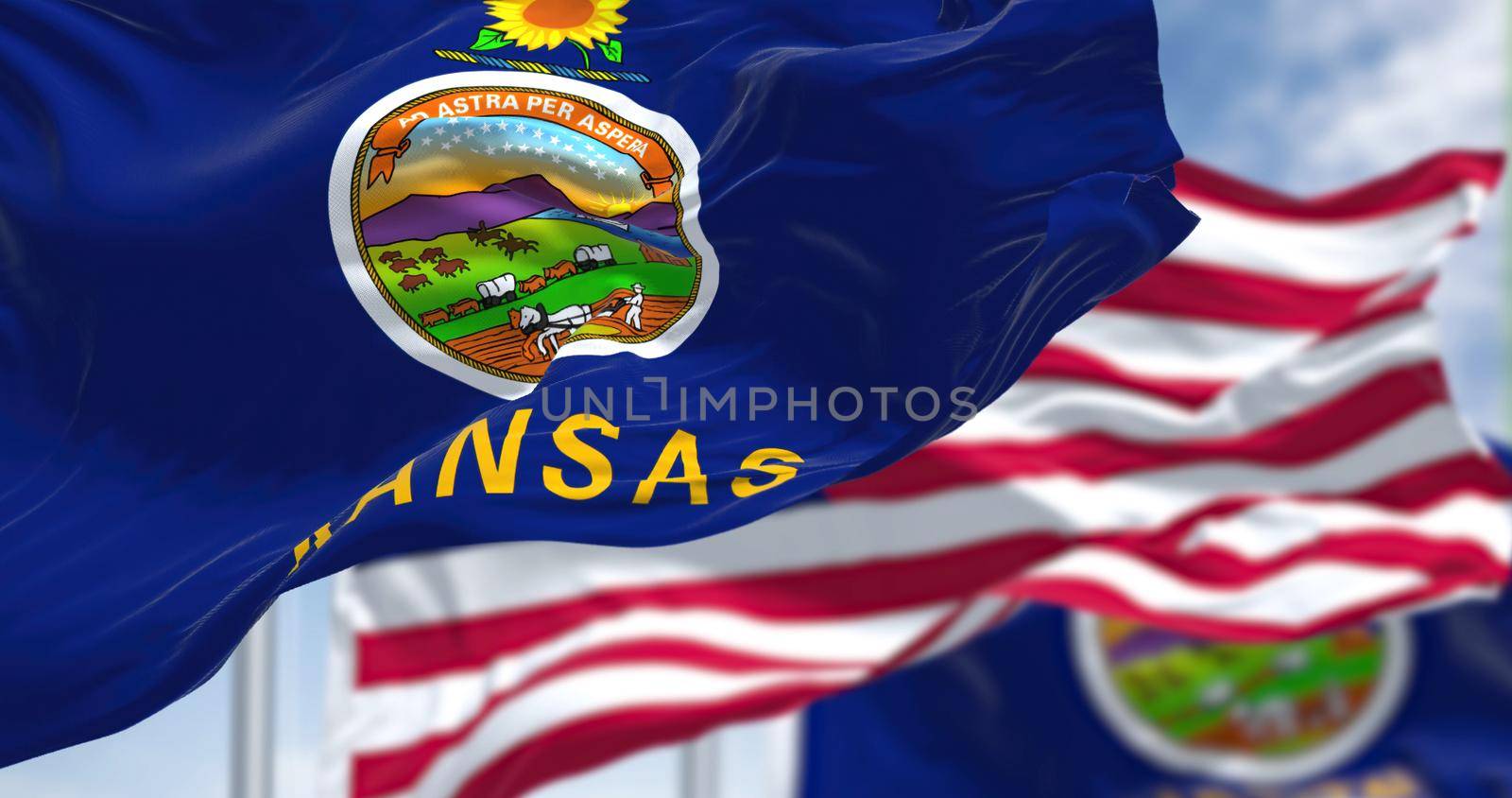 The Kansas state flag waving along with the national flag of the United States of America by rarrarorro