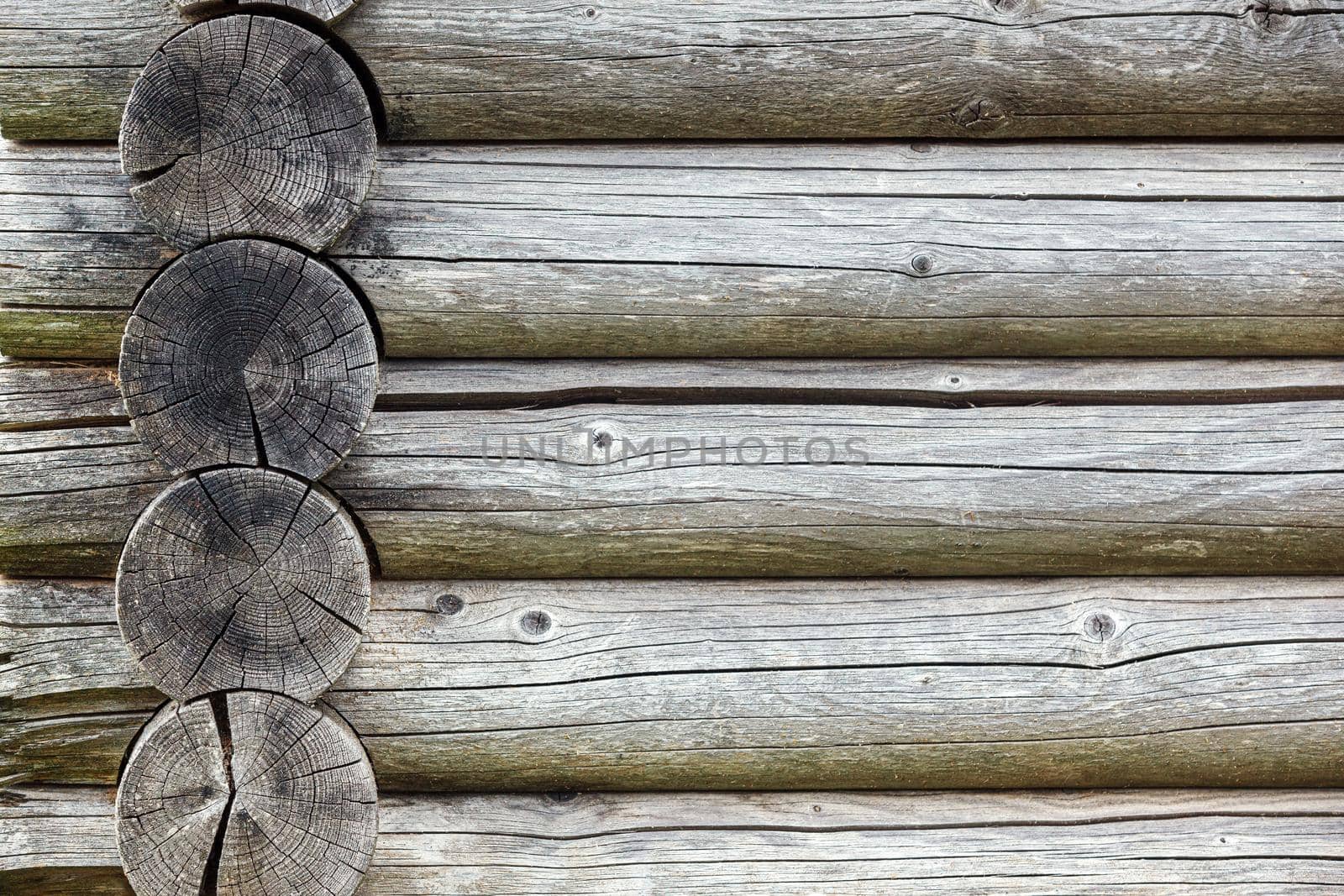 Old Rustic House Architectural Features Hut Built of Wood. Weathered Cracked Wooden Texture close-up by Lincikas