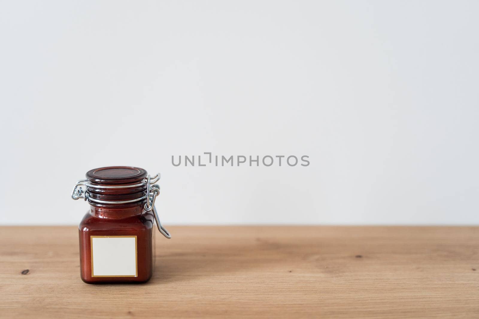 Scented candle in a glass jar on a white background by driver-s