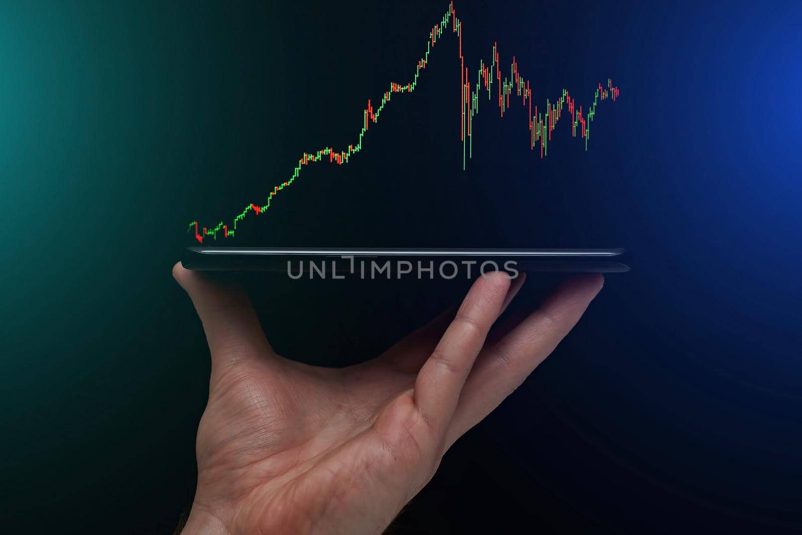 Stock market, Business growth, progress or success concept. Hand of Businessman or trader is showing a growing virtual hologram stock on smartphone