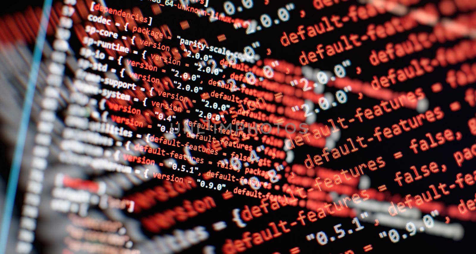 Security code on a computer display, close up. Database bits access stream visualisation. Php language and coding function developer