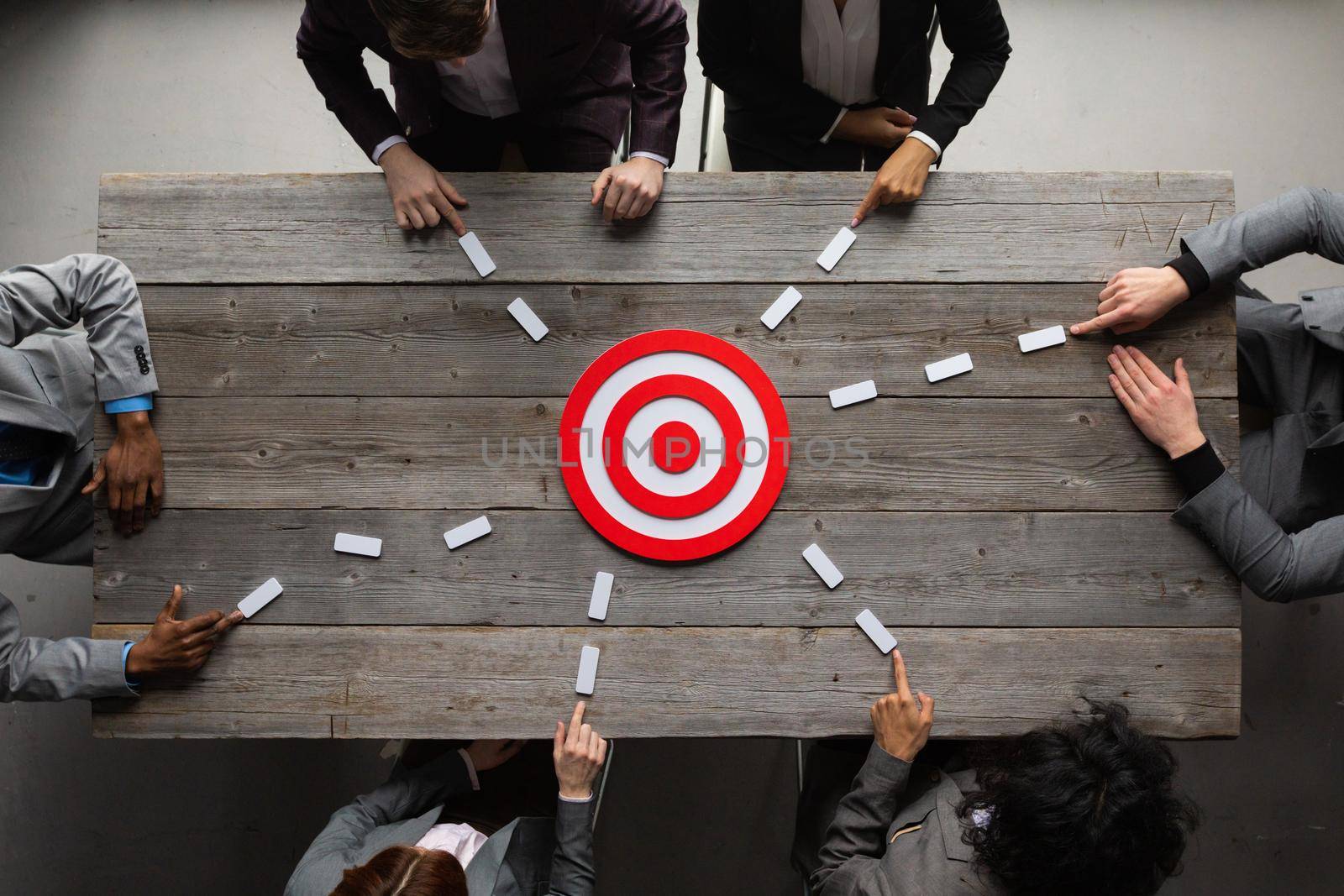 Business team pointing to target by ALotOfPeople