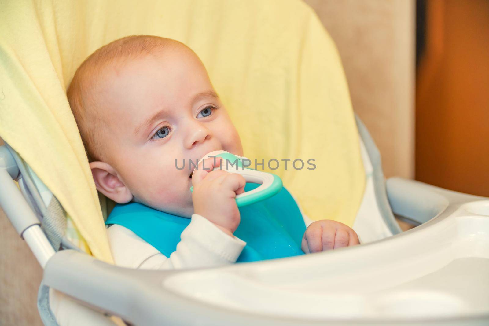 little boy eating sitting at the table