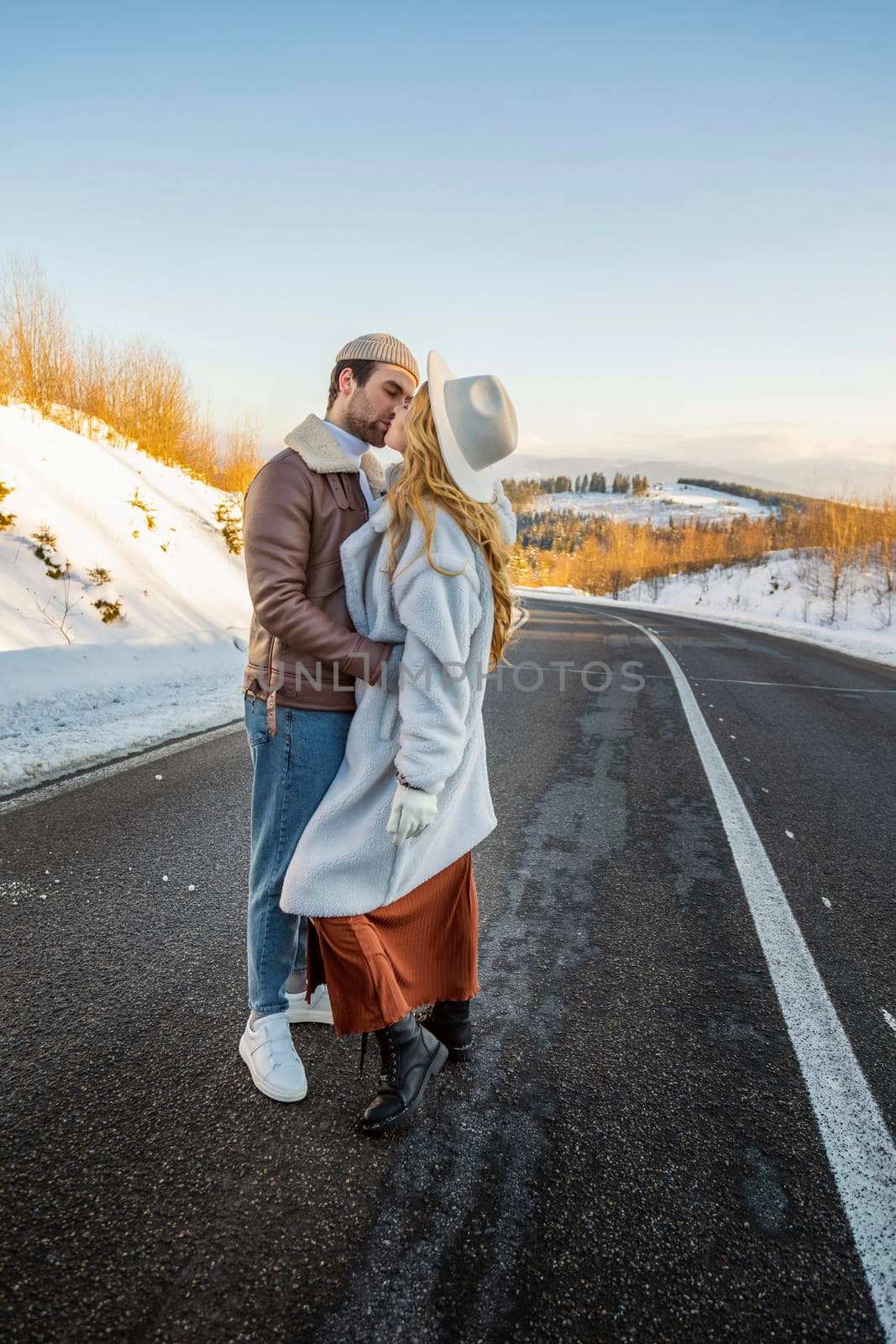 couple hugging on the road by zokov