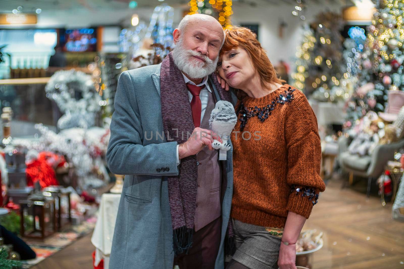 aged couple in the store choosing decor