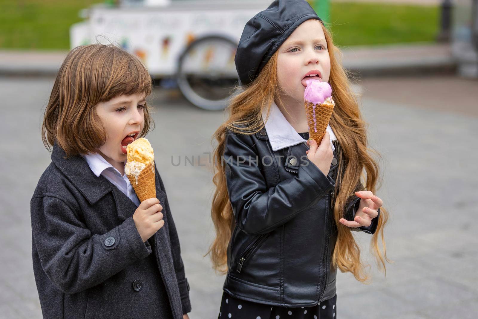 happy kids eating ice cream on the street