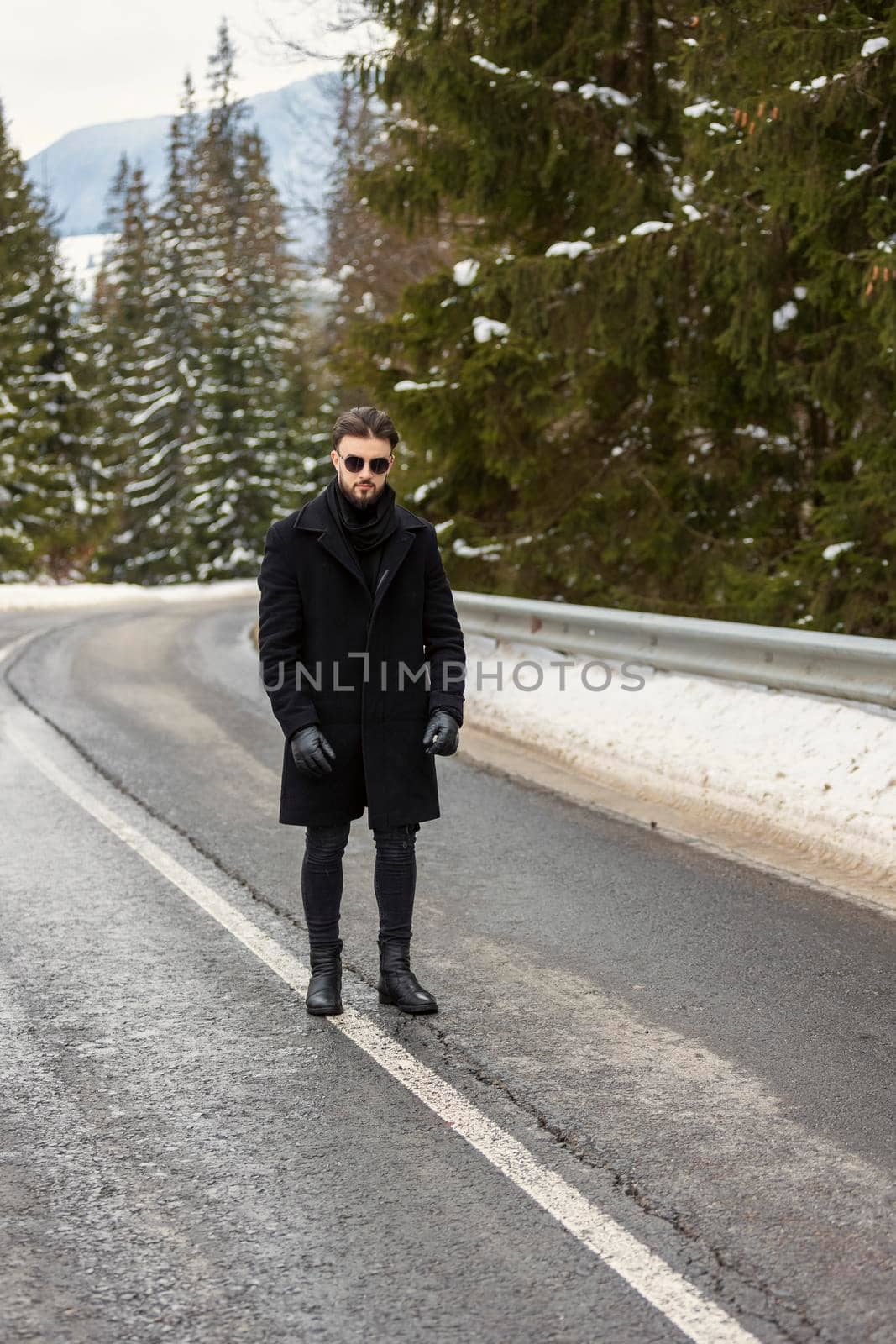 a man stands on the road by zokov