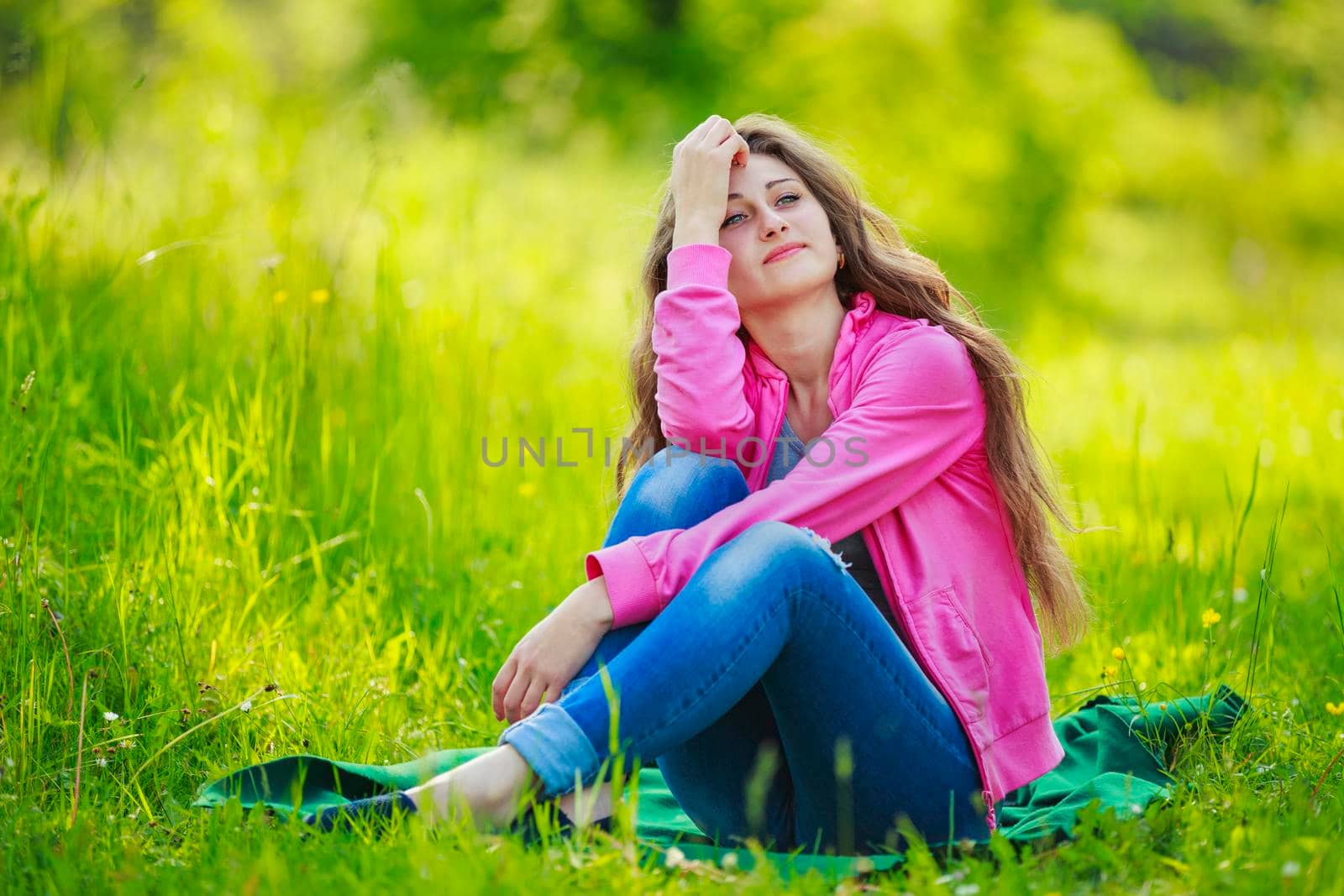 beautiful girl sitting in nature