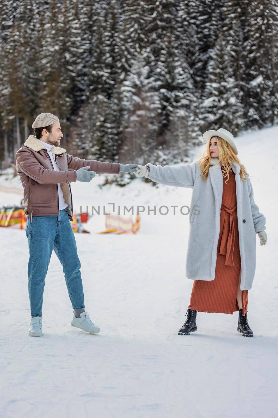 happy couple on the background of a snowy forest