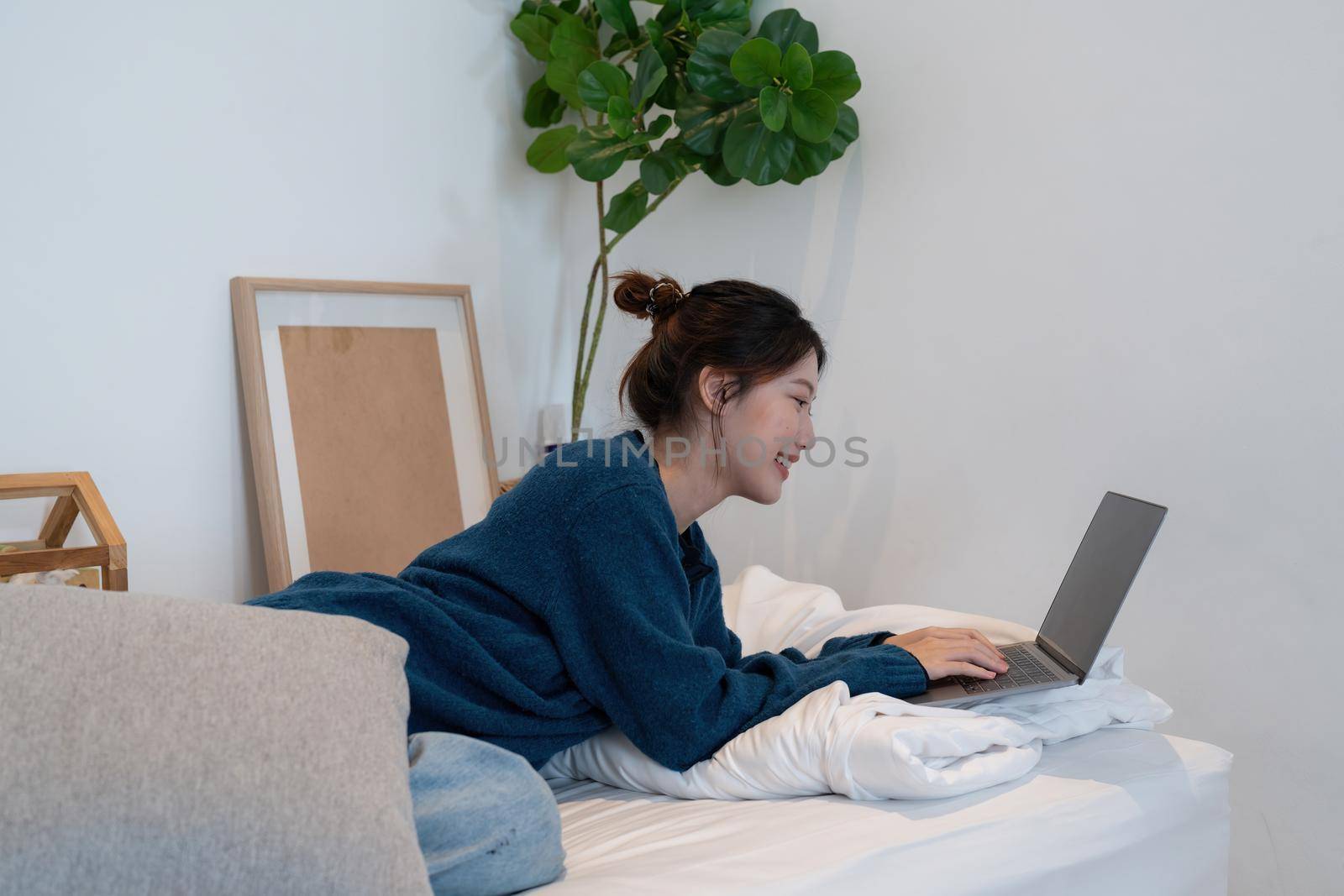 Young asian woman having conversation chatting while using laptop at house. Work at home, Video conference, Online meeting video call, Virtual meetings, Remote learning and E-learning.