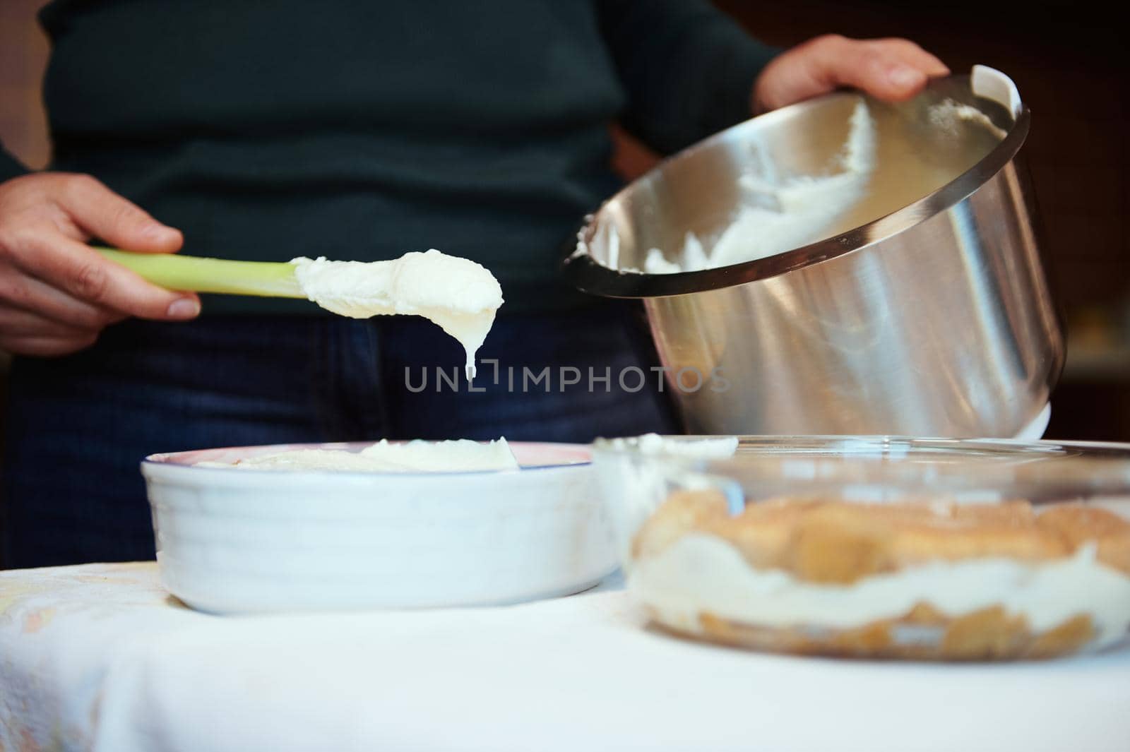 Close-up. Female chef pastry preparing cheese cream for cake at home. Culinary, homemade dessert by artgf