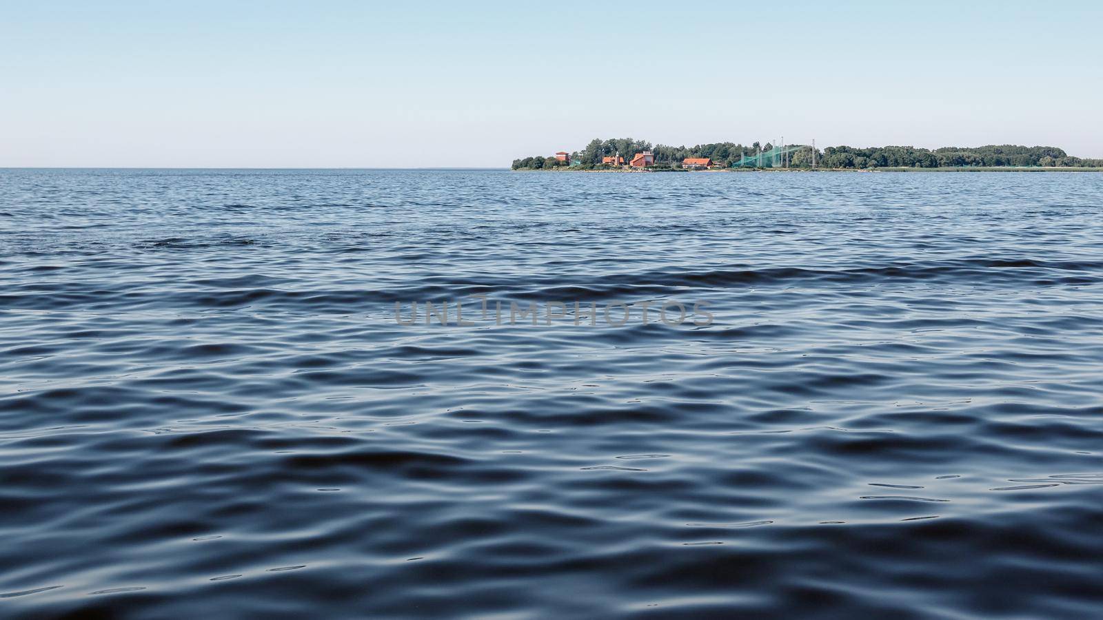 Curonian Lagoon water and Vente Peninsula in the distance. by Lincikas