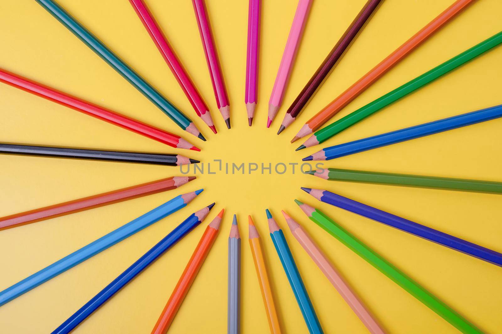 a few colored pencils on a yellow-blue background Develop creativity Get creative