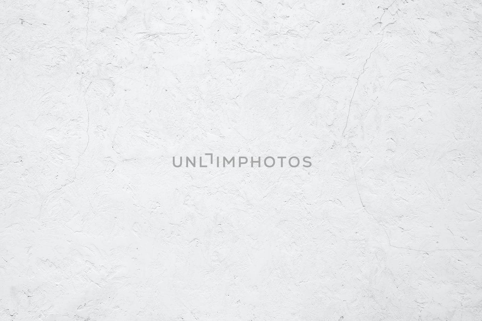 Empty white building wall texture background. Rough surface and cracked white cement wall. White wall texture abstract background. Concrete surface. Exterior concrete building wall. Plaster work.