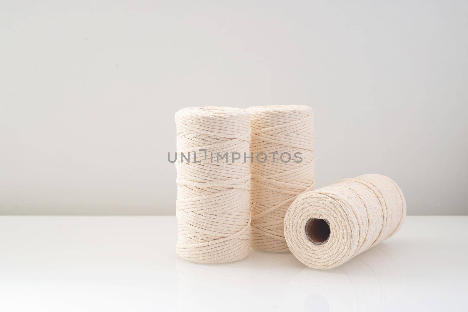 macrame threads wound bobbins of natural beige color by ozornina