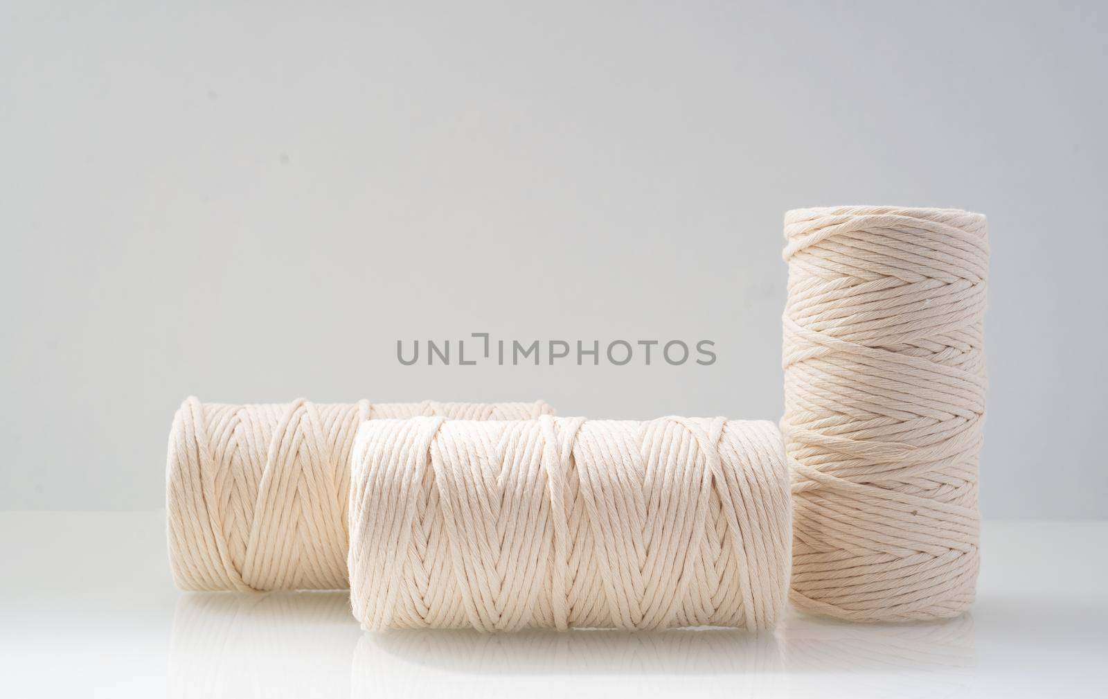 macrame threads wound bobbins of natural beige color by ozornina