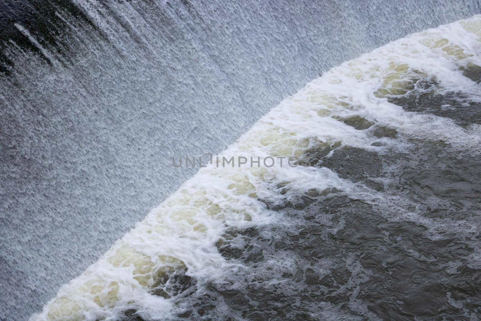 A small waterfall on a man-made river dam by lapushka62