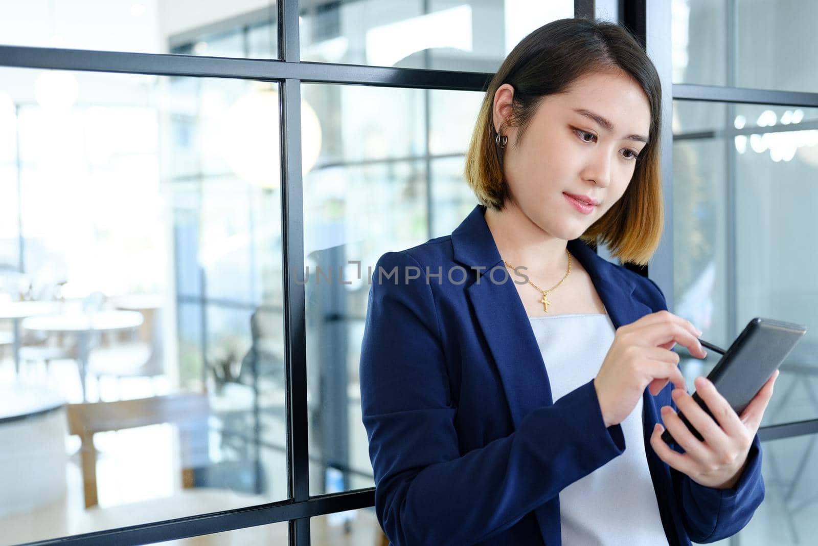 Young woman using a mobile phone by ijeab